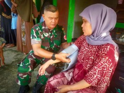 Satgas TMMD 120 Kodim 0619/PWK Menggelar Pengobatan Gratis di Desa Gurudug